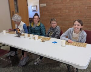 Parishioners playing bingo with residents of Ark Regional Services